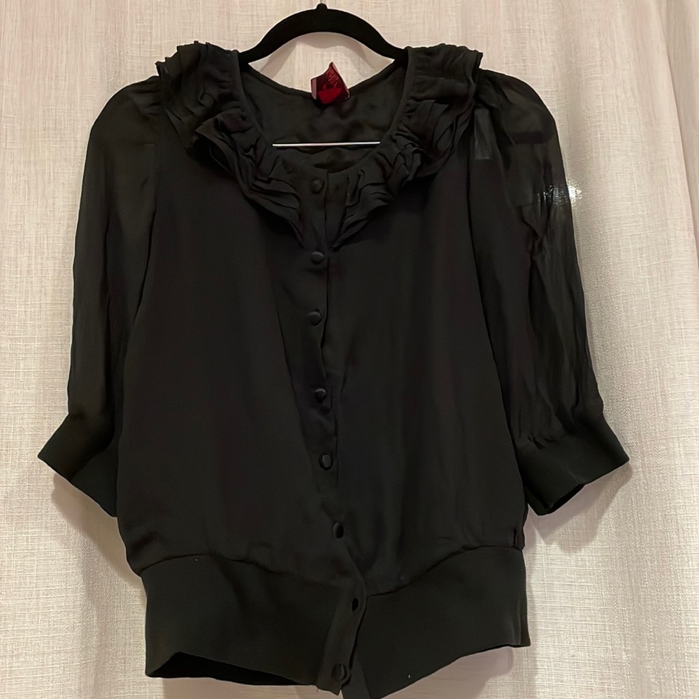 Juliette Longuet Black Top with ruffled neck and sheer sleeves